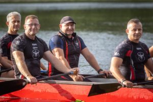 Wojciech Dajewski kayaking among friends.