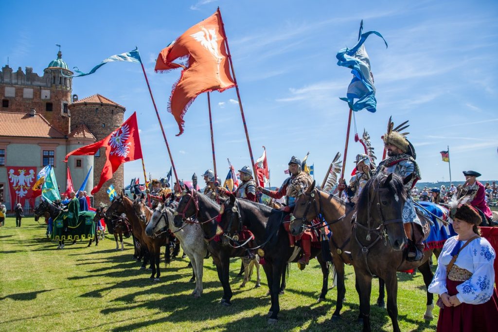 Knights' tournament in Golub-Dobrzyń, a line of riders with banners.